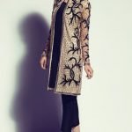 Black embellished jacket paired with shift and tailored pants (three piece set).