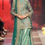 Heavily worked front, lehnga with heavy border.