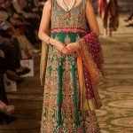 Bottle green organza shirt, green chatapati trail lehnga and plum organza dupatta.