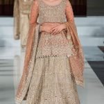 Tea pink peplum with grey organza lehnga and tea pink dupatta.
