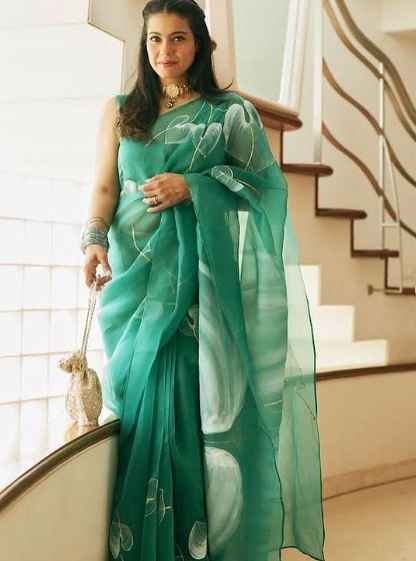 Kajol in an anthuriums on emerald green