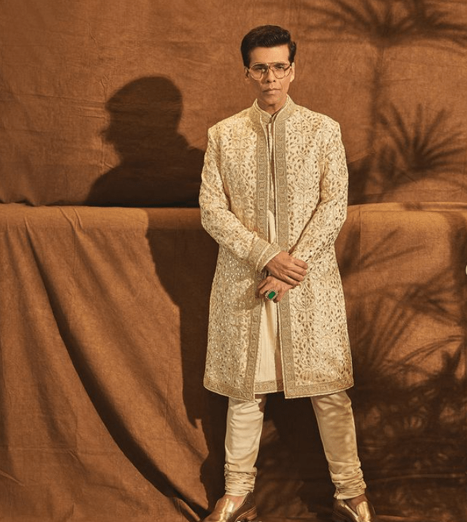 Karan Johar in a cream color sherwani