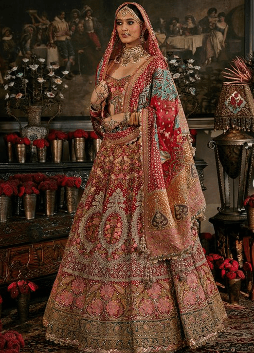 Deep red lehenga with floral and avian motifs