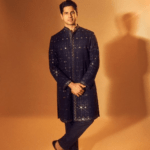 Sidhartha Malhotra in a dark brown color sherwani